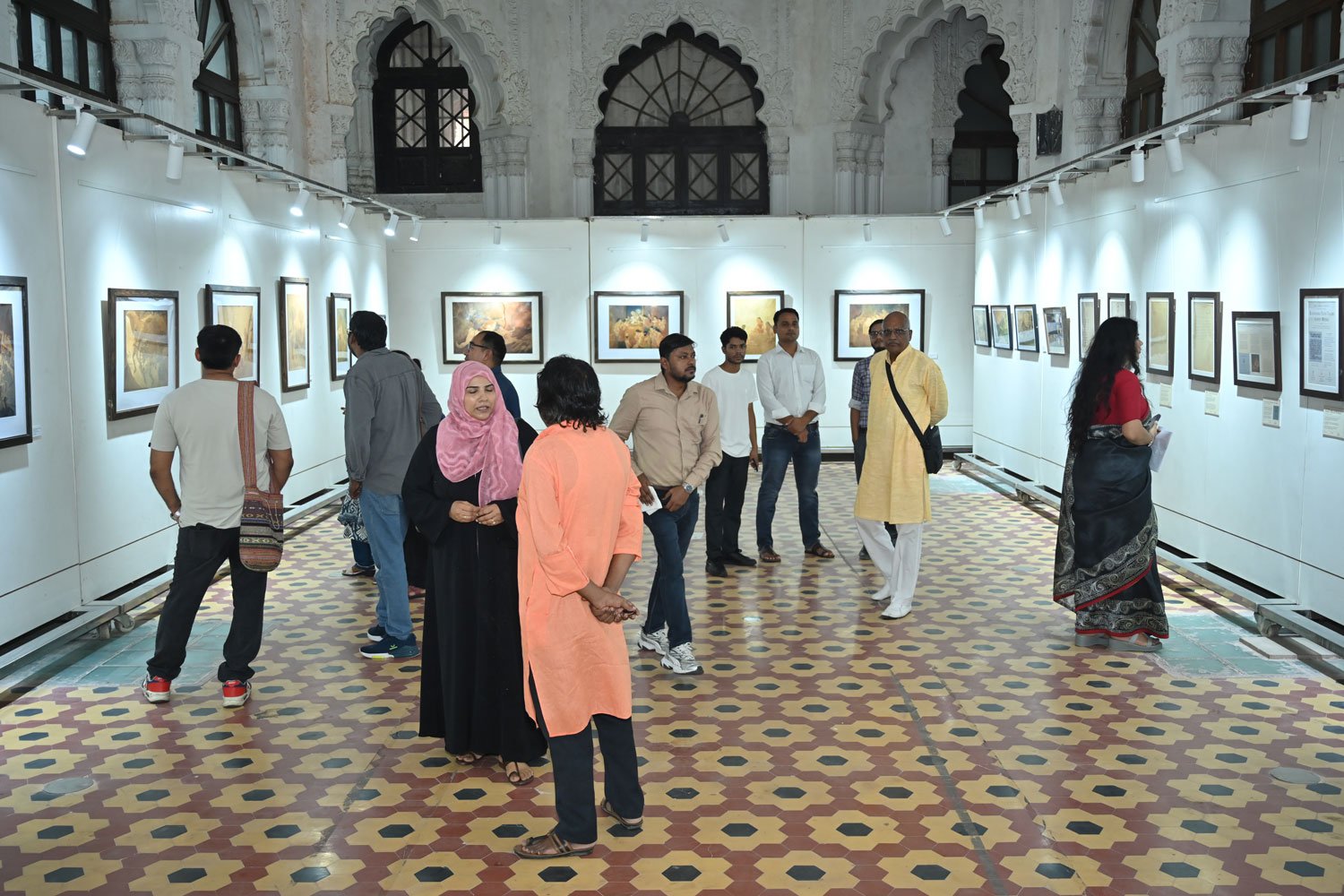 Guests viewing archival records and historical documents displayed as part of the exhibition.